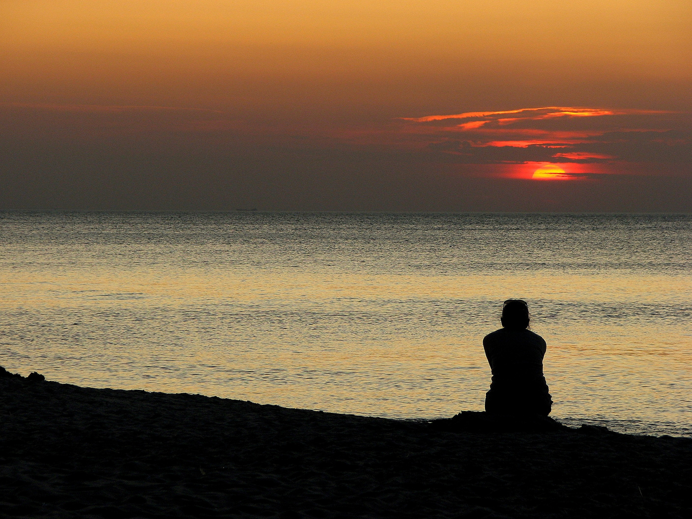 Silhouette of a Woman by the Sea